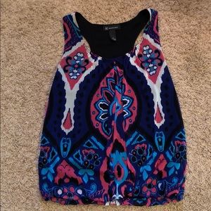 INC multi color razor back tank blouse. Size med